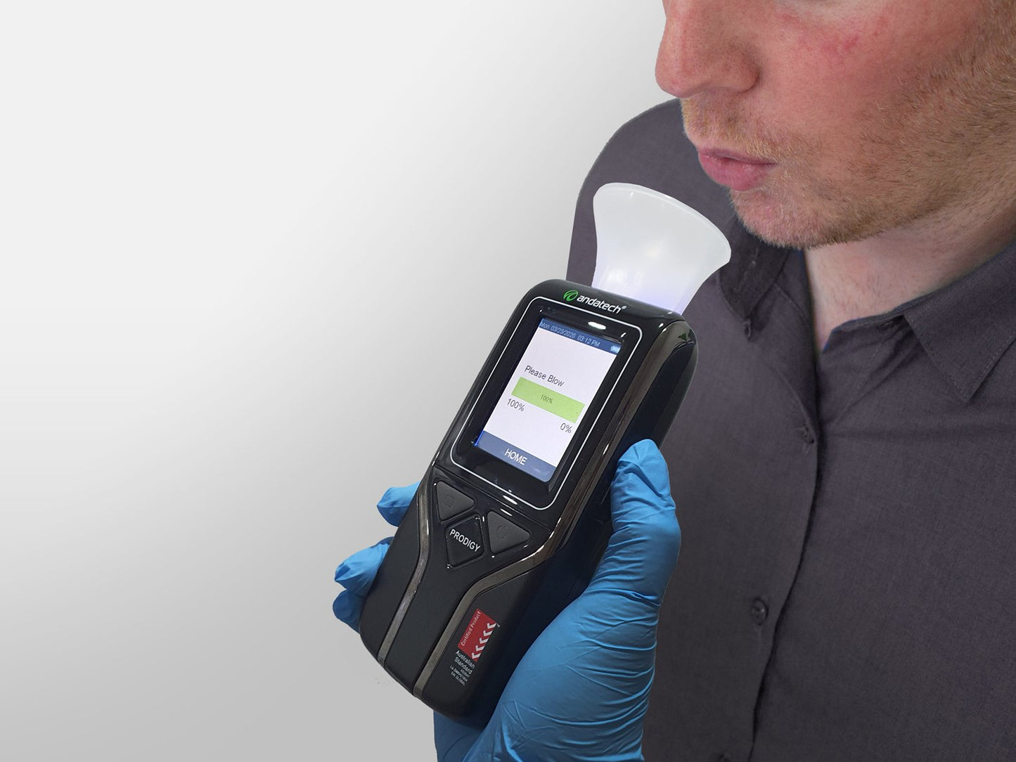 Blowing into Andatech Prodigy S sampling cup